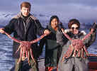 Nurse Hinson with local residents and king crab on fishing boat from Belkofski to King Cove AK March 1971