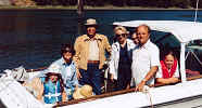 Becky with parents and kids on boat of Art and M. L. Griffin July 1980