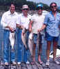 Mike with Becky's father and brothers and striped bass Lake Buchanan June 1983