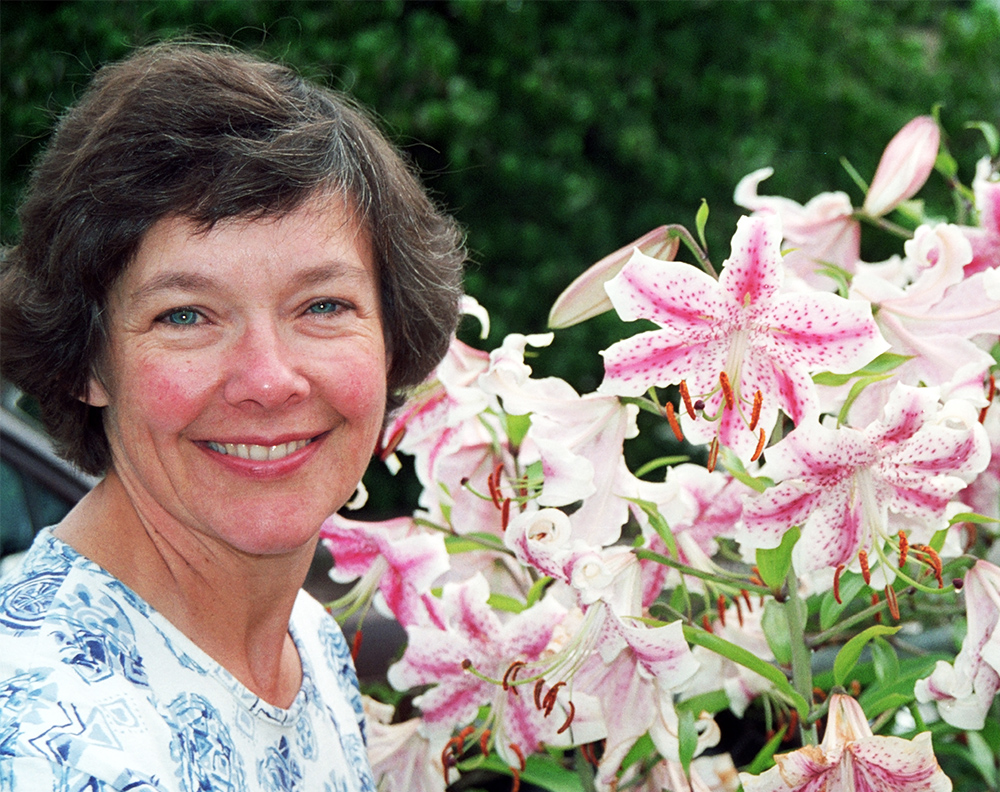 Rebecca McGoodwin with lilies in her garden, August 1993 (photo by MCM)